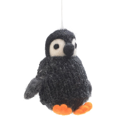 Winter gets chilly. That's why this penguin ornament comes with a cute little sweater!
