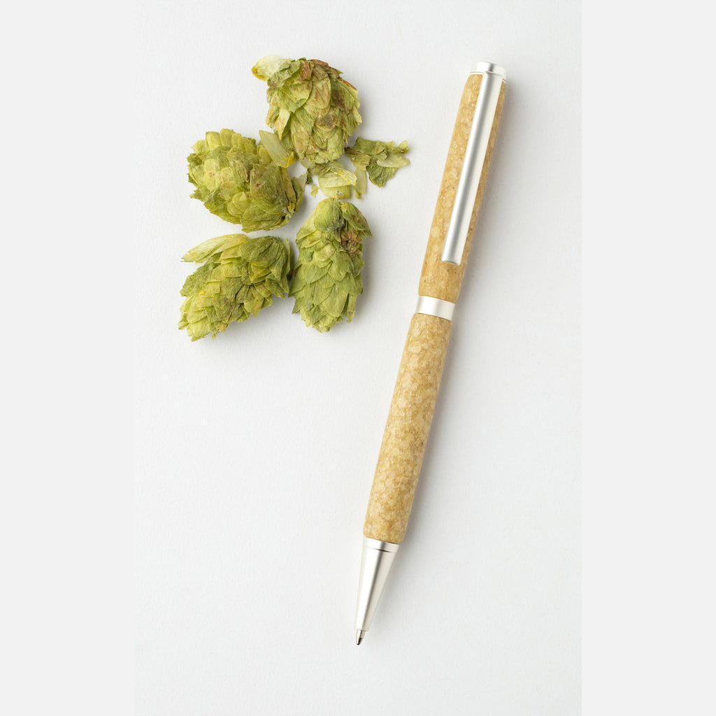 Handmade beer pen is crafted with transparent polymer and textured with hand-ground, locally grown hops for craft beer enthusiasts.