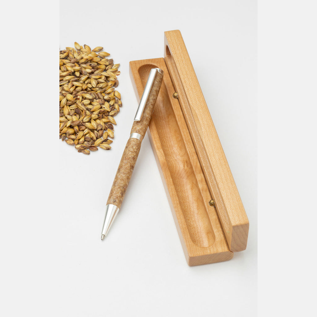 This handmade happy hour whiskey pen is crafted with transparent polymer and textured with hand-ground, malted barley from a Tennessee distillery. Shown with gift box.