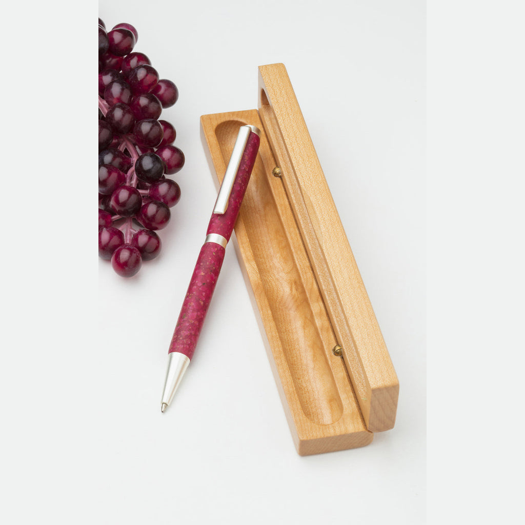 Merlot hued handmade happy hour wine pen is crafted with transparent polymer and textured with locally grown dried crushed grapes. Shown with gift box.